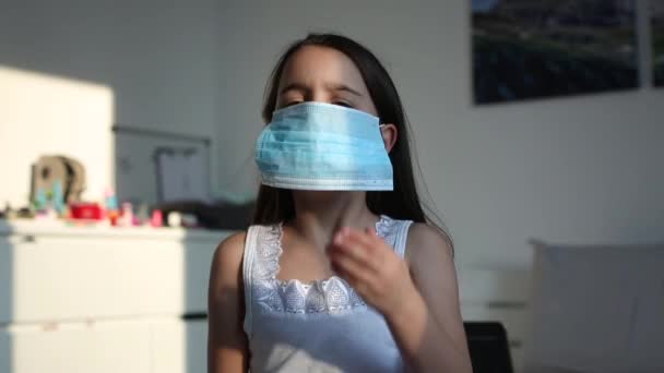 Sick asian little child girl wear protection mask while live in the hospital in slow motion shot — Stock Video