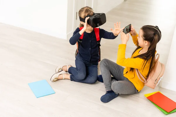 Two girls in headset virtual vr reality. Childhood kids education lifestyle concept — Stock Photo, Image