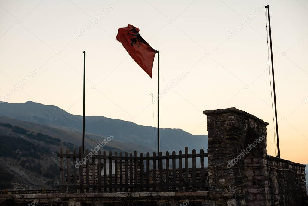 Panoramic view to Gjirokastra castle with the wall, tower and Clock in Gjirokaster, Albania