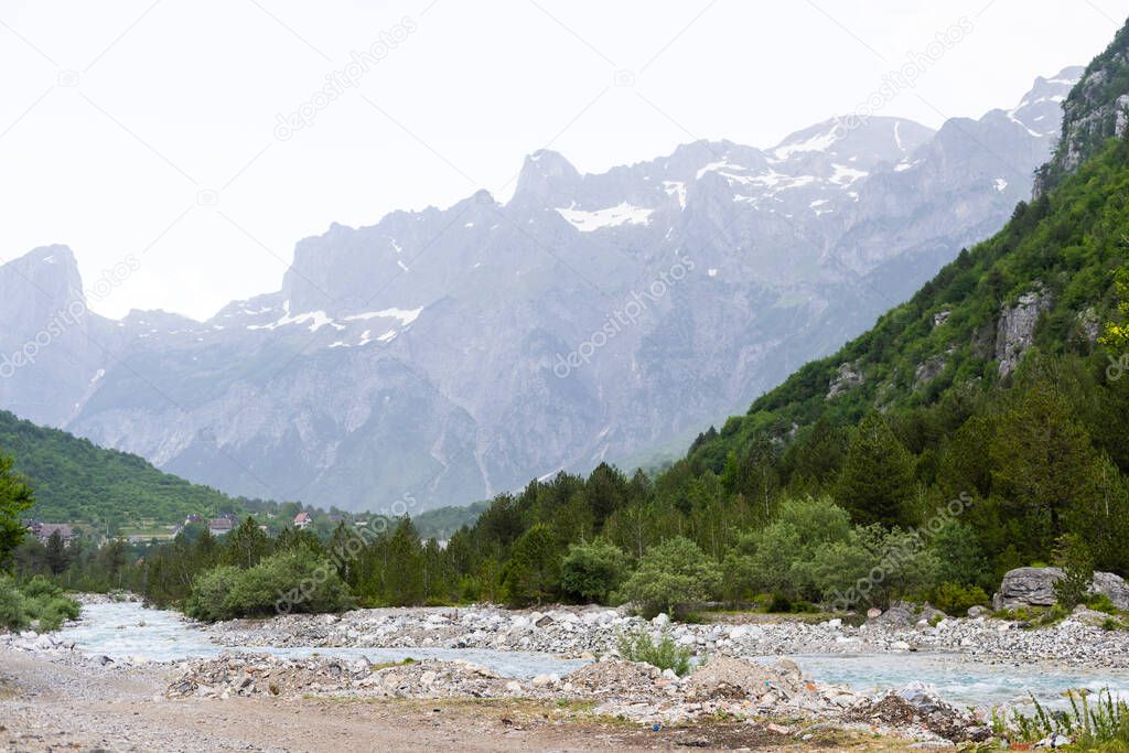 Mountain landscape with houses and farms in Theth in the Albanian alps
