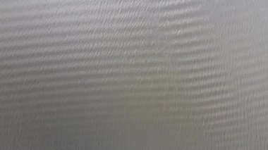 Aerial view of drone. Scene of Top view beach sand and sea water clear. Sea water texture on beach sand.