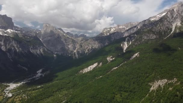 Theth National Park, Albania. Aerial view of albanian alps at sunrise. Flying over green trees overlooking the village of Thethi and majestic mountains. The Accursed Mountains in Albania Prokletije — Stock Video