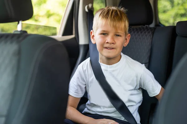 Little blond kid boy in the car — Stock Photo, Image