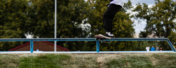 Skateboarder performs a trick in the city.