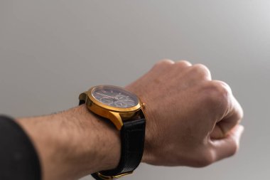 Mens Wrist Watches, a watch on a mans hand.