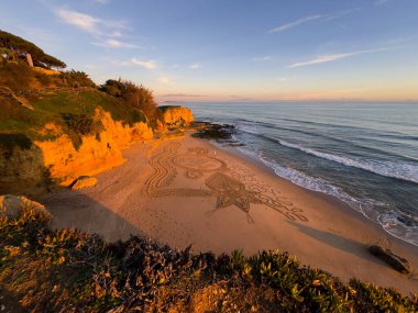 Gün batımında kumsalda Mandala. Yüksek kalite fotoğraf