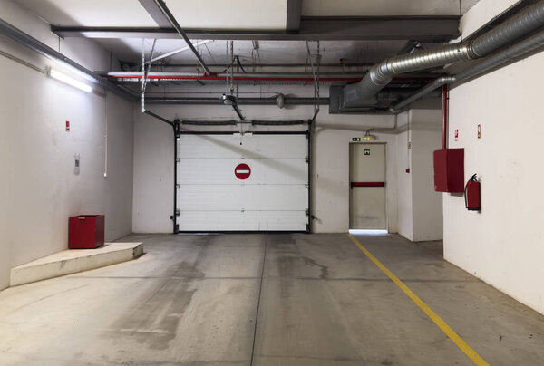 Front view of underground garage entrance gate. High quality photo