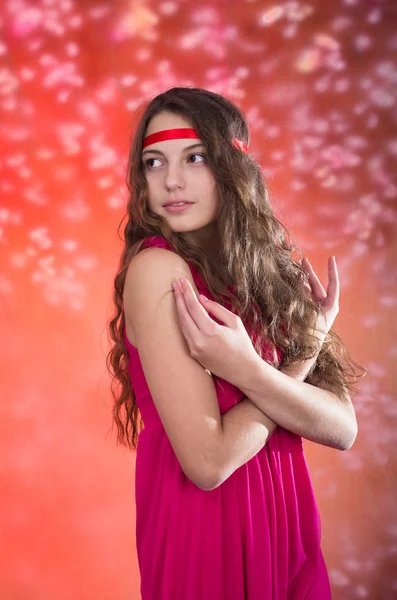 Beautiful teen girl in red dress — Stock Photo, Image