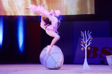 MINSK, BELARUS DECEMBER 05: unidentified gymnast from ' Grodno' participate with 'Bird of paradise'  in 'Baby Cup - BSB Bank' children's competitions in gymnastics , 05 December 2015 in Minsk, Belarus