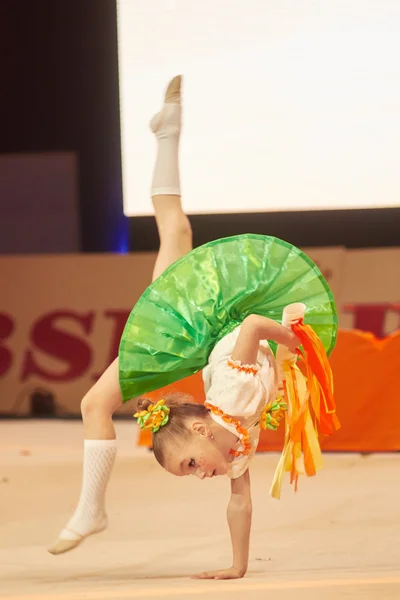 MINSK, BELARUS DECEMBER 05: Myat Milana from ' Baranovichi' participate with 'Orange song'  in 'Baby Cup - BSB Bank' children's competitions in gymnastics , 05 December 2015 in Minsk, Belarus. — Zdjęcie stockowe