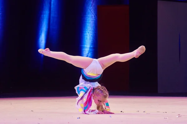 MINSK, BELARUS DECEMBER 05: unidentified gymnast from ' Smolevichy' participate with 'Miraculous transformation'  in 'Baby Cup - BSB Bank' children's competitions in gymnastics , 05 December 2015 in M 免版税图库图片