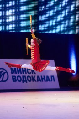 MINSK, BELARUS DECEMBER 05: Leshkevich Karolina from ' Baranovichi' participate with 'Drummer'  in 'Baby Cup - BSB Bank' children's competitions in gymnastics , 05 December 2015 in Minsk, Belarus.