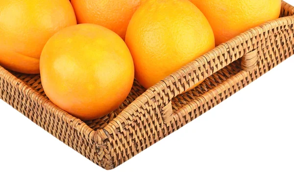 Orange on wickered tray — Stock Photo, Image