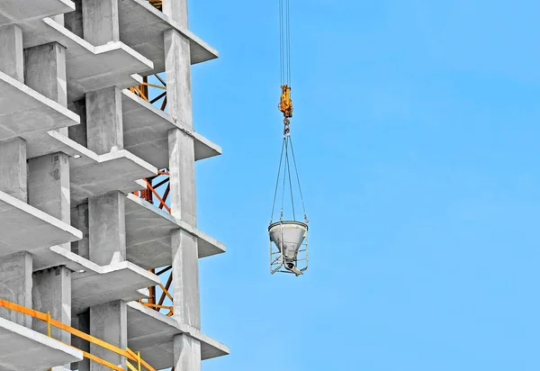 Crane lifting cement mixing container — Stock Photo, Image