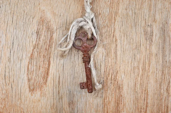 Vintage key on wooden background — Stock Photo, Image