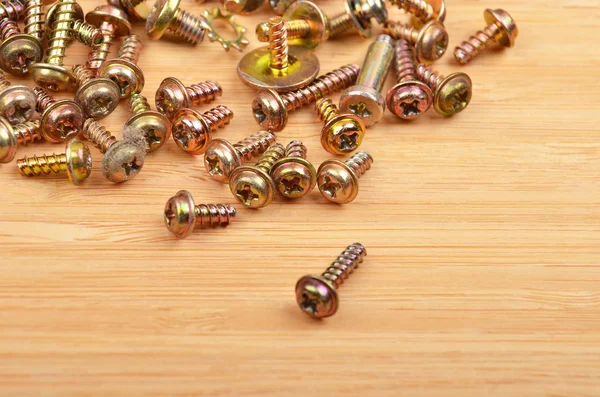 Screw on wooden background — Stock Photo, Image