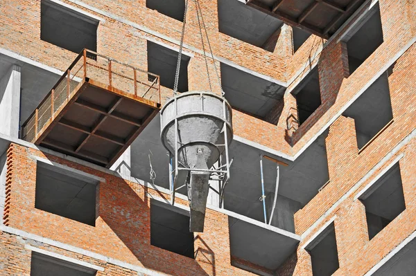 Crane lifting cement mixing container — Stock Photo, Image