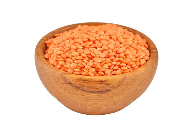 Red lentil in wooden bowl — Stock Photo, Image