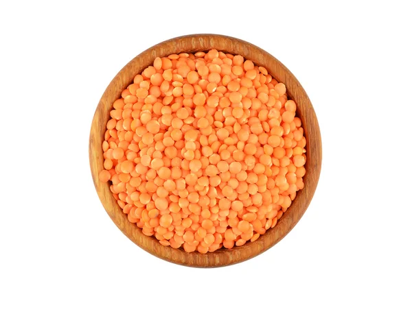 Red lentil in wooden bowl — Stock Photo, Image