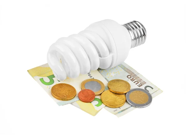 Energiebesparende lamp en geld — Stockfoto