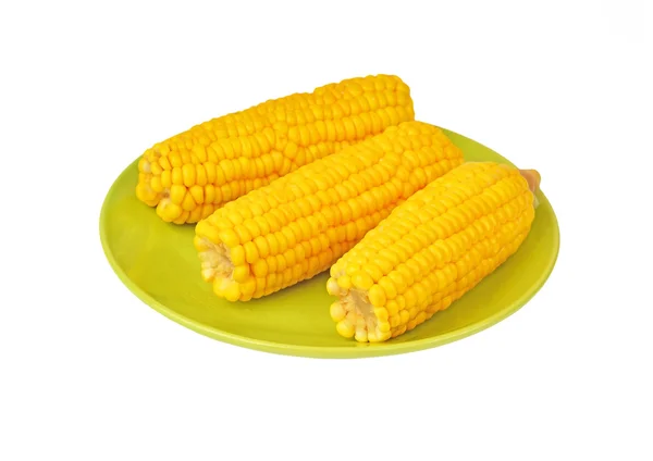 Cob of corn on green plate — Stock Photo, Image