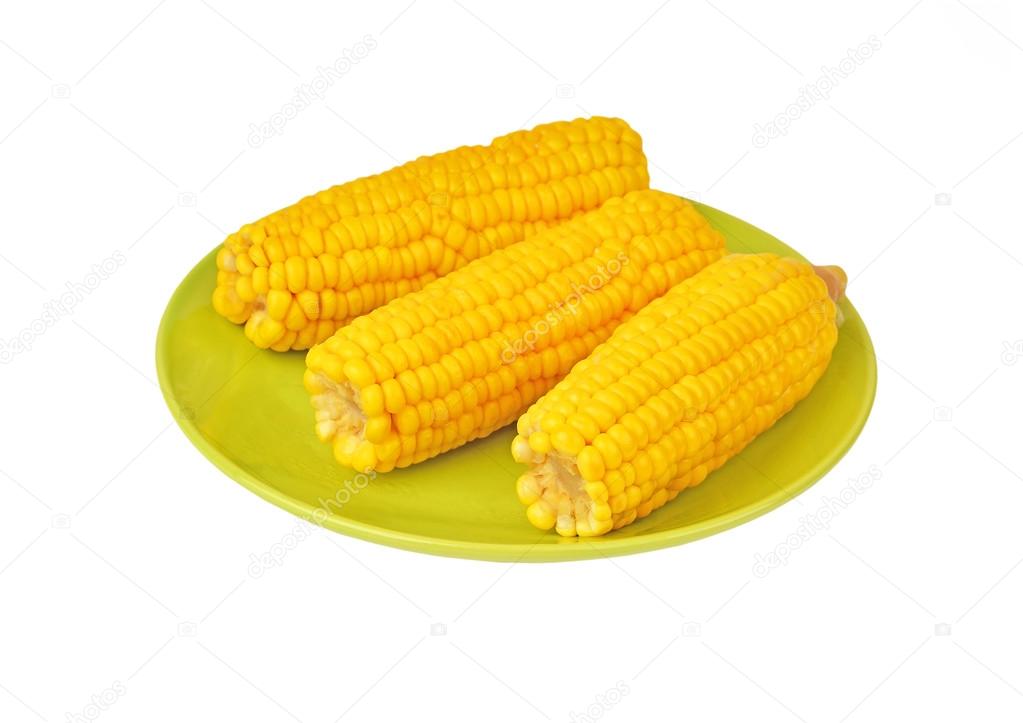 Cob of corn on green plate