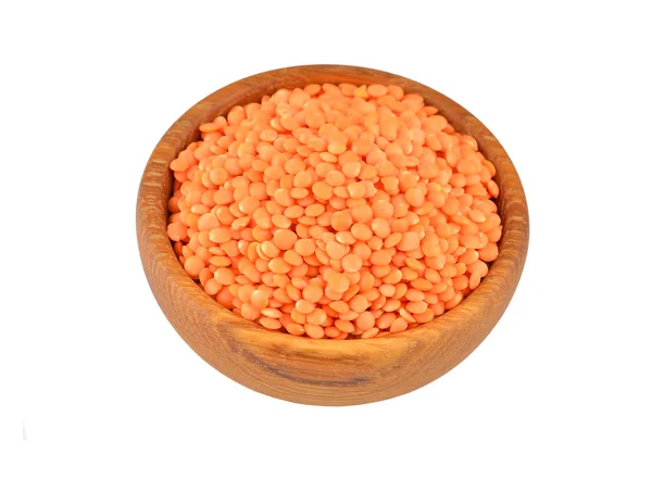 Red lentil in wooden bowl — Stock Photo, Image