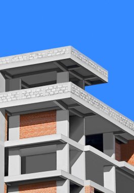 Mavi gökyüzüne karşı beton ve tuğladan yapılmış yerleşim yeri