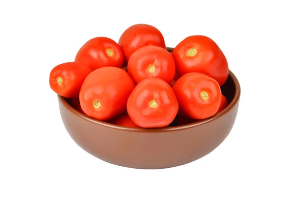 Tomate em prato de barro — Fotografia de Stock