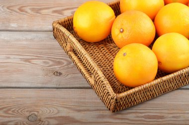 Orange wickered tepsi