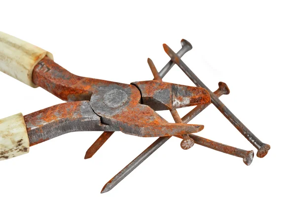 Rusty nail and wire cutter — Stock Photo, Image