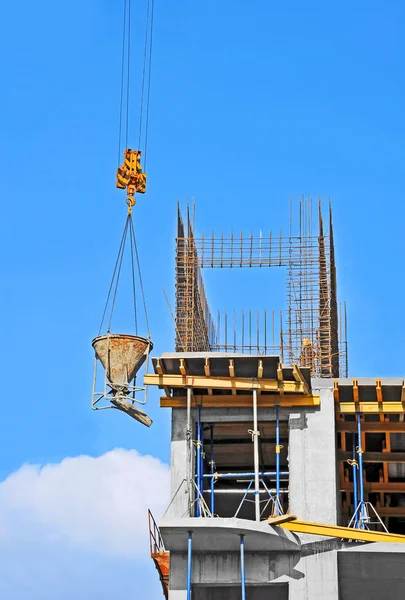 Crane lifting cement mixing container — Stock Photo, Image