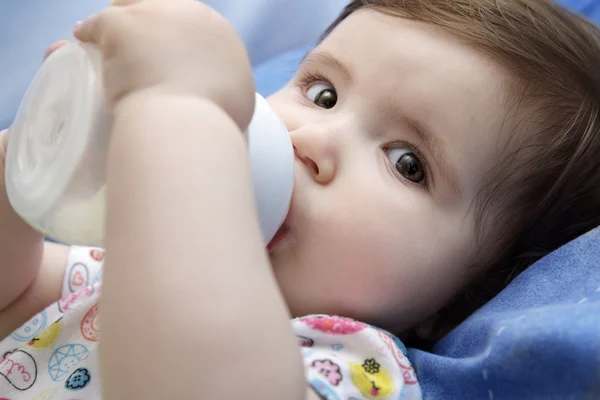 Baby drinking milk Stock Image
