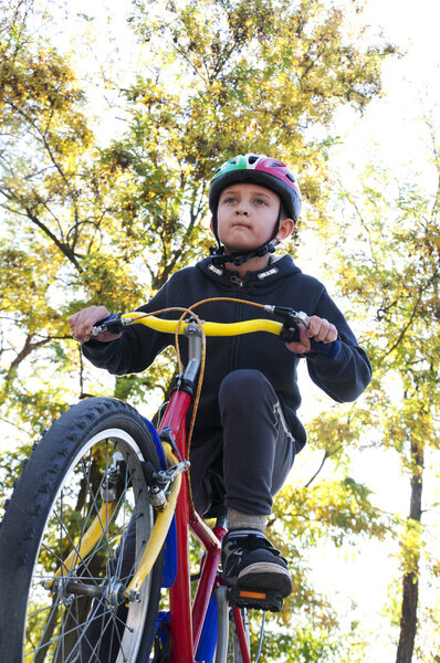 boy riding a bike in the park