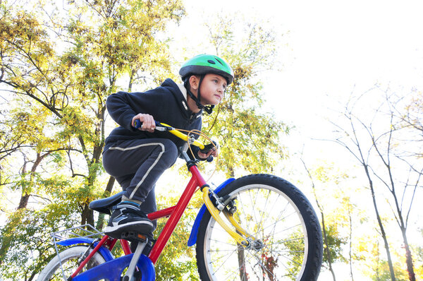 boy riding a bike in the park