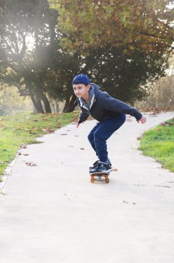 boy rides a skateboard clipart