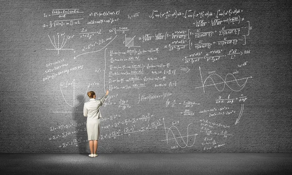 Woman drawing formulas — Stock Photo, Image