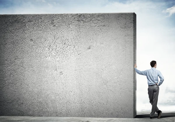 Guy and concrete empty banner — Stock Photo, Image