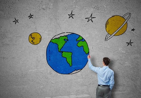 Businessman presenting drawn Earth planet — Stock Photo, Image