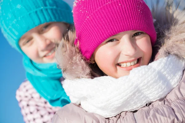 Cute girls riding sled — Stock Photo, Image