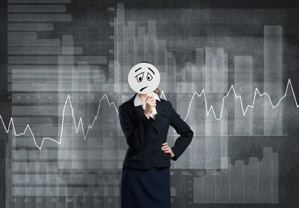 Businesswoman hiding her face behind mask — Stock Photo, Image
