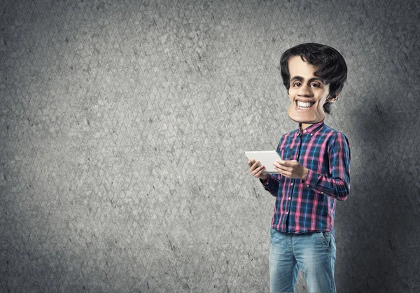 Funny bigheaded man with tablet in hands — Stock Photo, Image