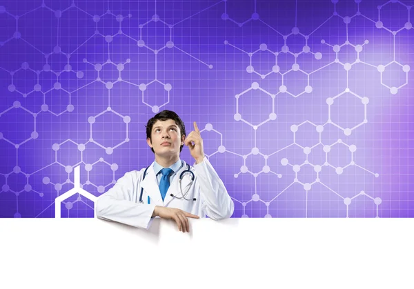 Doctor with blank banner — Stock Photo, Image