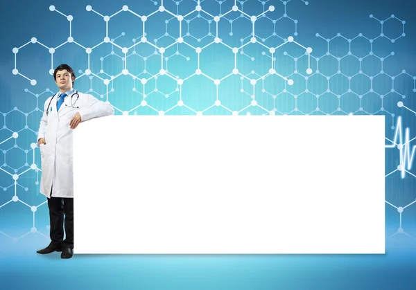 Doctor with blank banner — Stock Photo, Image