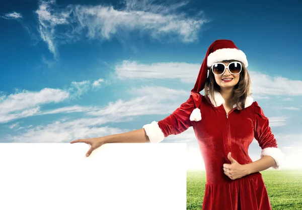 Weihnachtsmann Frau mit Banner — Stockfoto