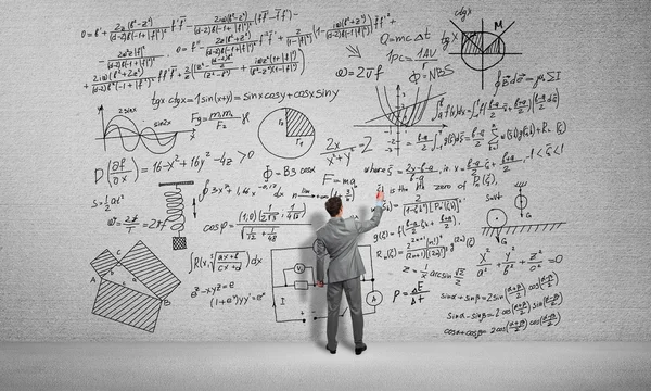 Man drawing science formulas — Stock Photo, Image