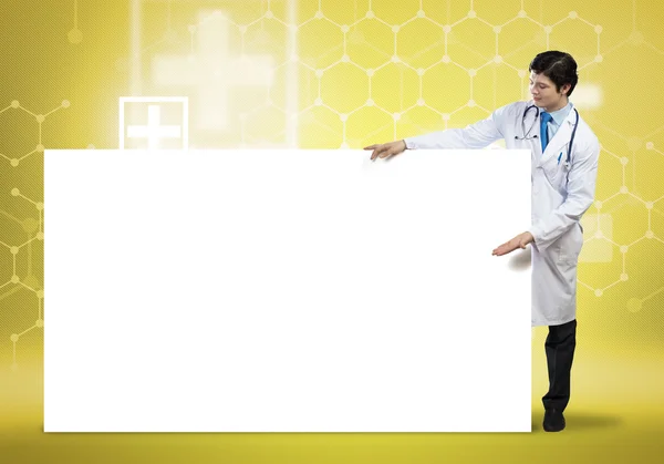 Doctor con banner en blanco — Foto de Stock