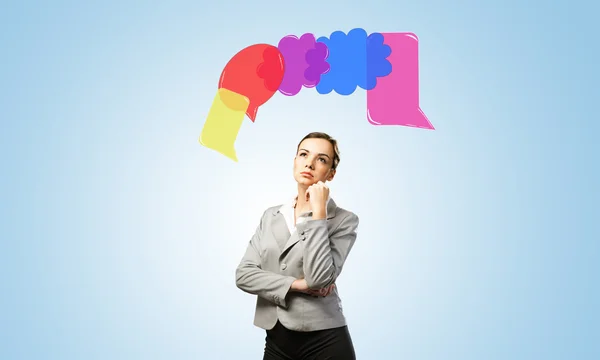 Speech bubbles above businesswoman — Stock Photo, Image