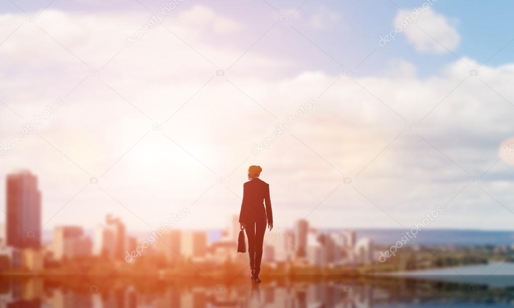 Businesswoman facing new day