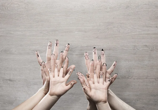 Mani di famiglia con volti — Foto Stock